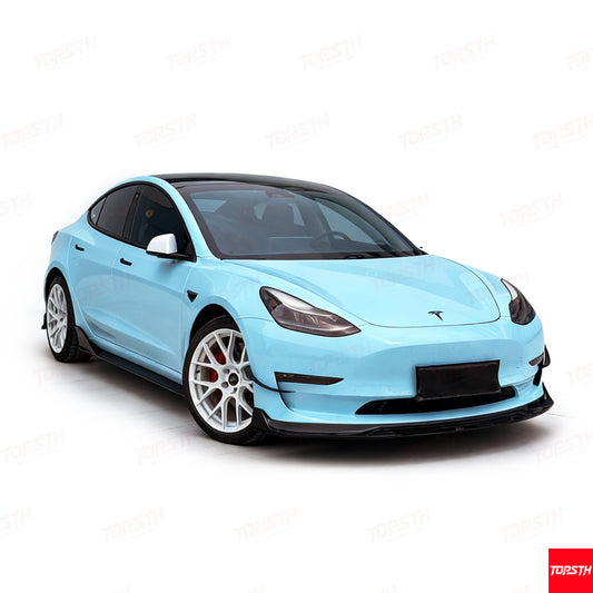 Full exterior view of a light blue Tesla Model 3 with complete aerodynamic body kit upgrade.