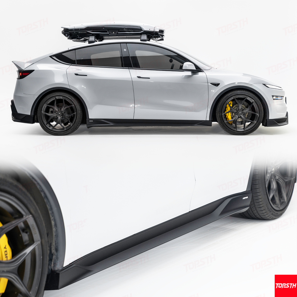 White car with black roof rack and yellow brake calipers on a white background