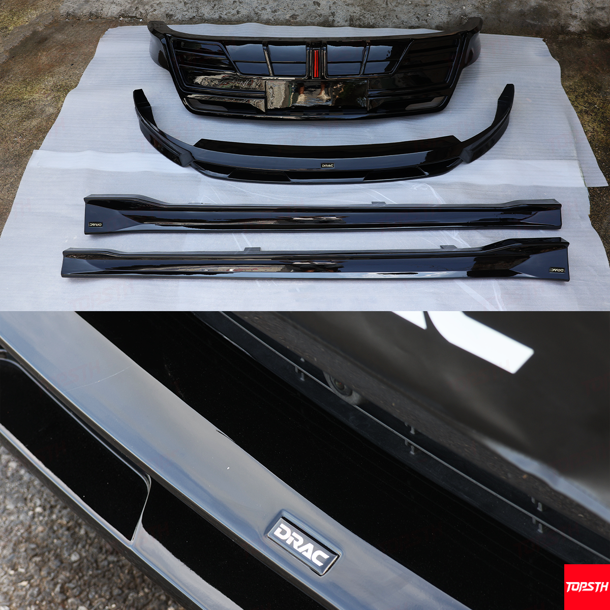 Car bumper and grille set with DRAC branding on a concrete surface