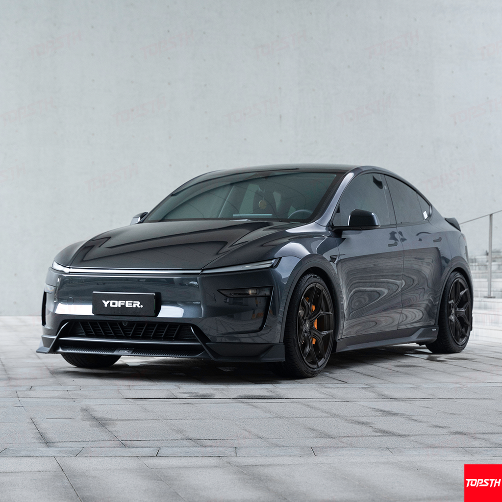 Black YOFEER car on a gray pavement with a light gray wall background