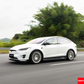 Side view of the white Tesla Model X (2016-2020) driving, showcasing the full YOFER Design body kit.