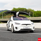 White Tesla Model X (2016-2020) with YOFER Design Full Body Kit installed, featuring falcon wing doors open.