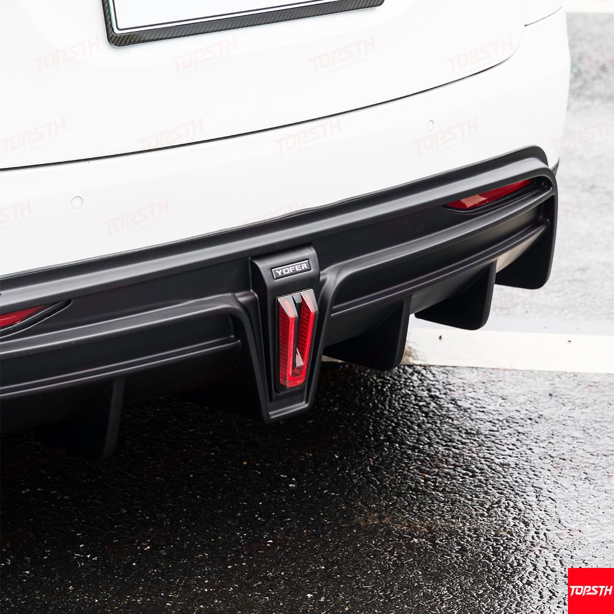 Close-up of the YOFER Body Kit rear diffuser on the Model X bumper, featuring integrated fog/brake lights.