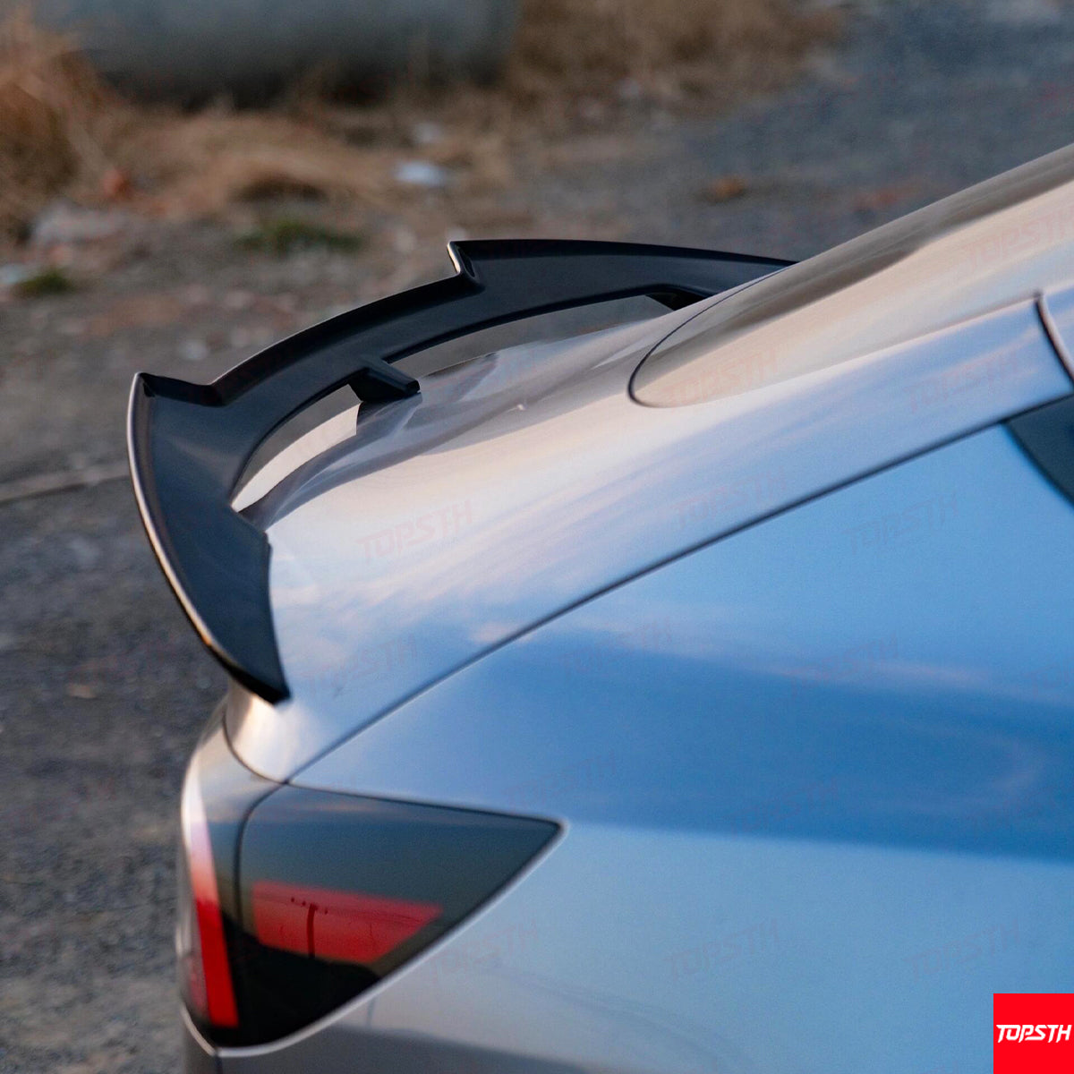 Close-up detail of the black ABS rear trunk spoiler wing for the 2024+ Tesla Model 3 Highland.