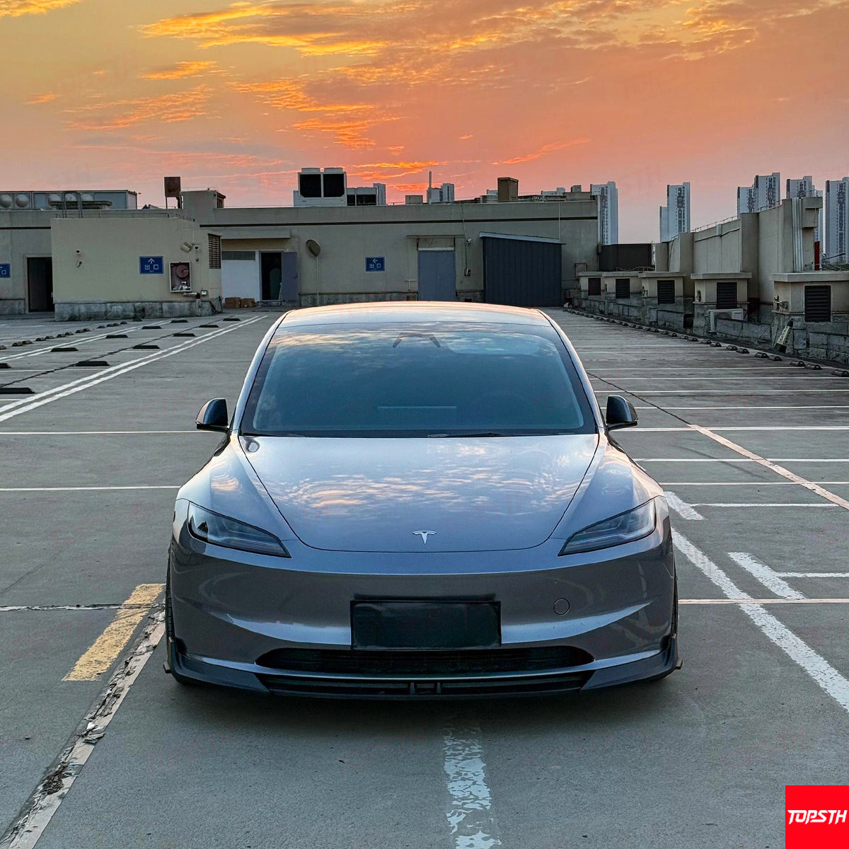 Front view of the 2024 Tesla Model 3 Highland featuring a matte black ABS front lip spoiler.