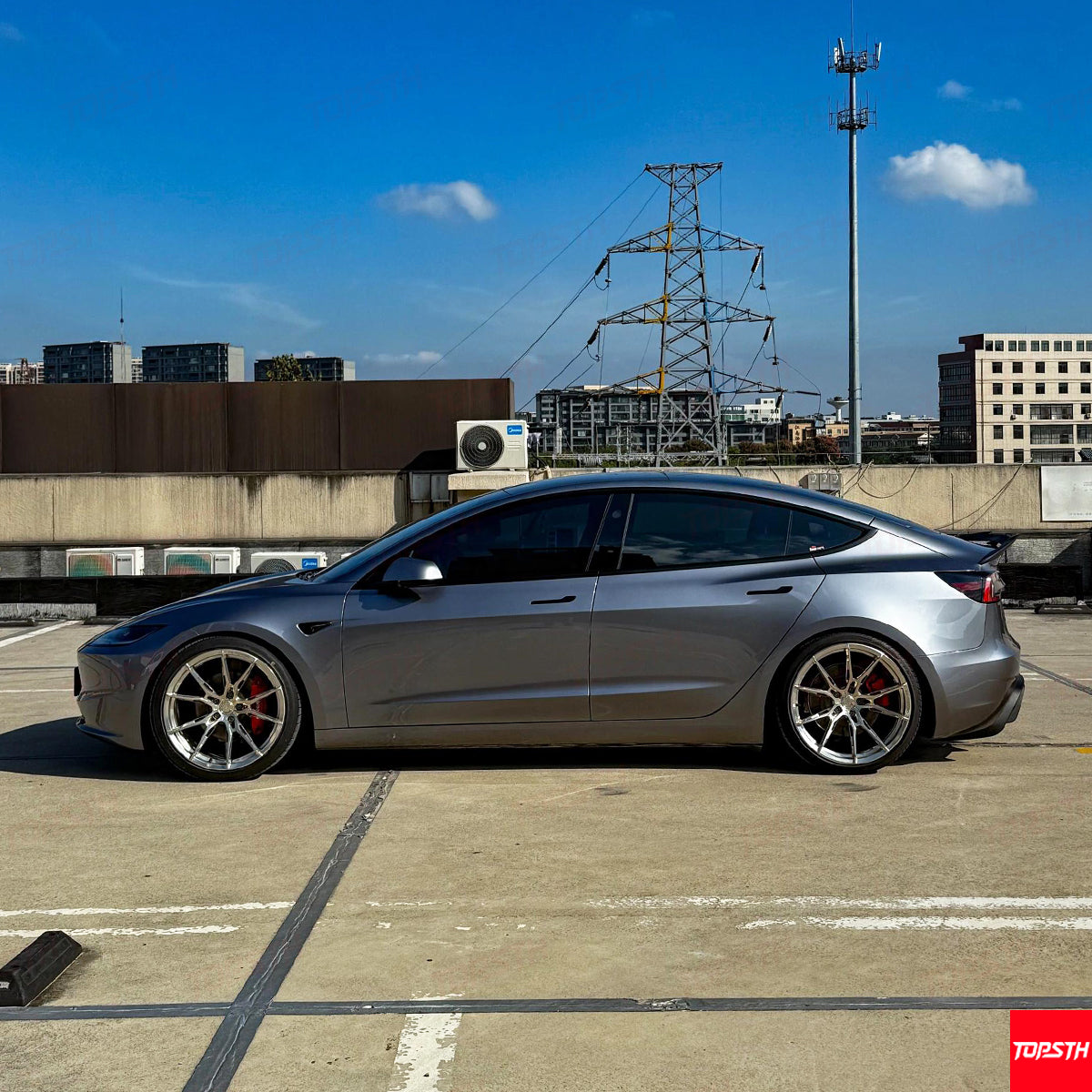 Complete side profile of the Tesla Model 3 Highland with full ABS body kit and upgraded sport rims.