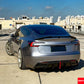 Rear perspective of Tesla Model 3 Highland showcasing the aggressive ABS rear diffuser and trunk wing.