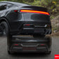 Close-up detail of a Tesla Model Y upgraded rear LED taillight system and carbon fiber style diffuser.