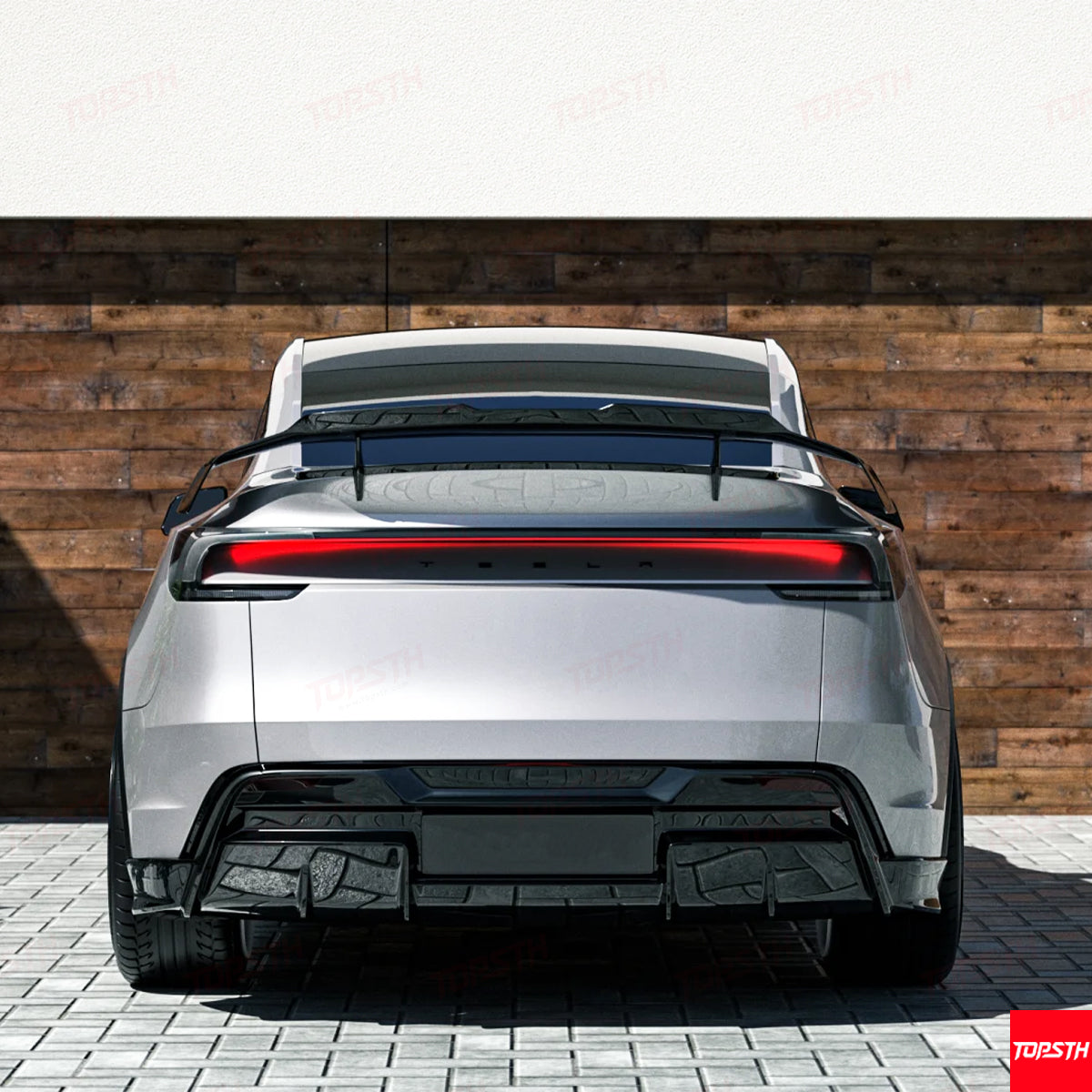 Rear view of a white Tesla Model Y with a premium gloss carbon fiber trunk wing for improved downforce.