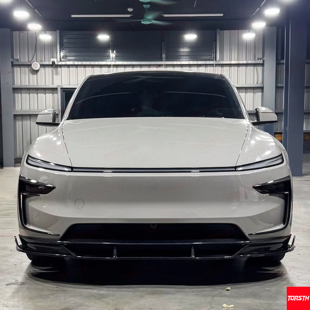 Straight front view of the Tesla Model Y Juniper with the complete Carbon Fiber EL Design kit, highlighting the fascia.