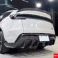 Close-up side/rear view of the Carbon Fiber EL Design Rear Diffuser and side skirt on the Model Y Juniper.